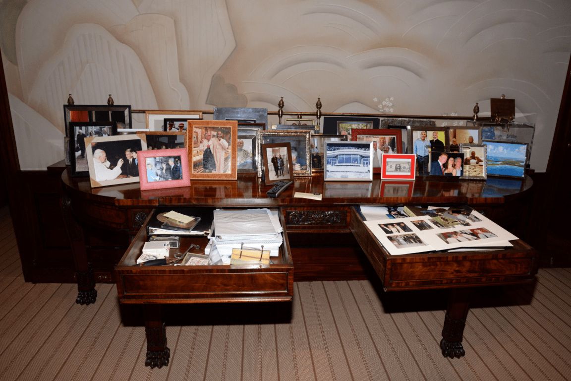 FBI evidence photo of a desk in Epstein’s Manhattan townhouse during the July 6, 2019, search. Among the framed photos is one of Trump, a woman and Epstein.